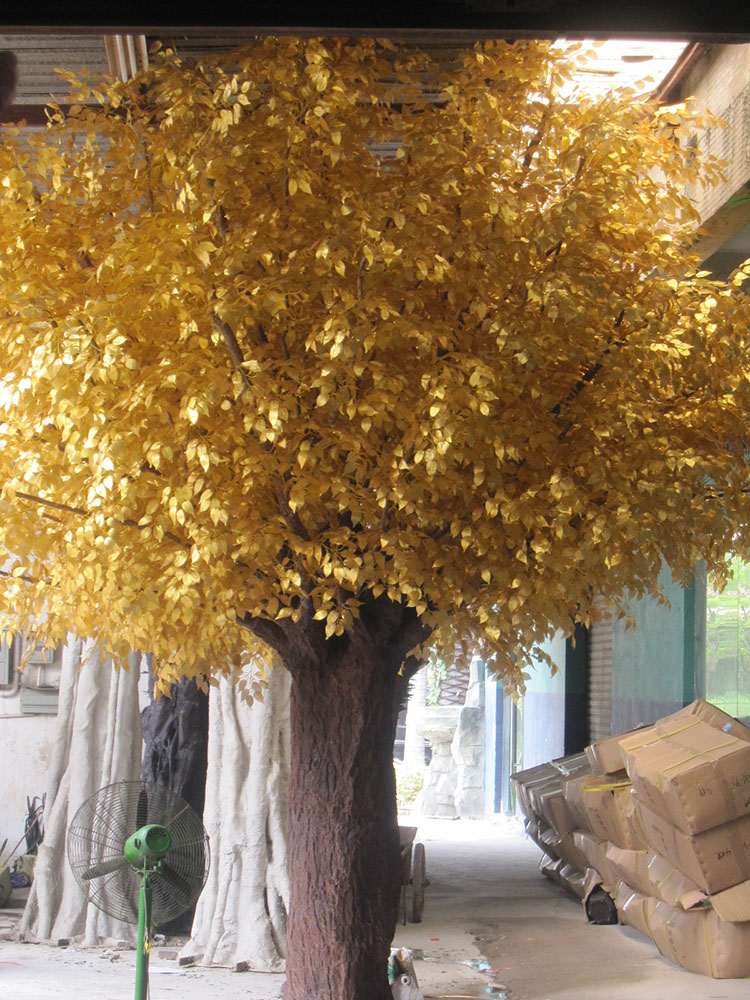 Large indoor golden artificial ficus banyan tree