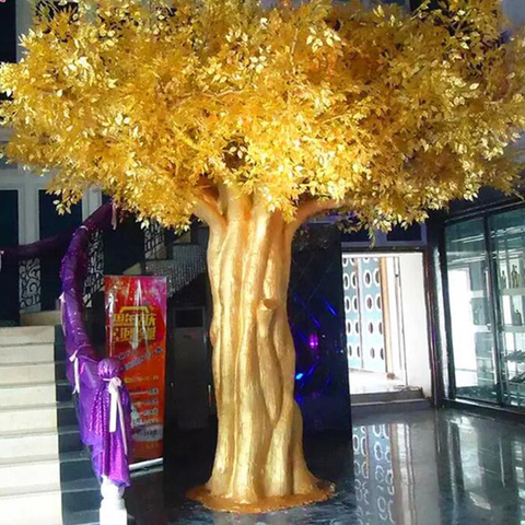 Large indoor golden artificial ficus banyan tree